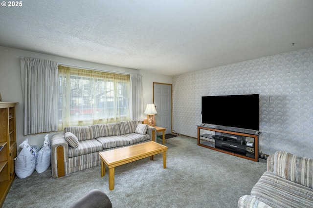 living room featuring carpet floors and a textured ceiling