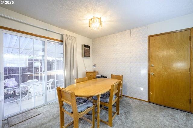 carpeted dining area with a wall unit AC and a textured ceiling