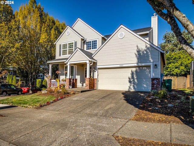 15337 SE Olds Dr, Clackamas, OR 97015 - traditional home featuring a porch, brick siding, driveway, and a chimney