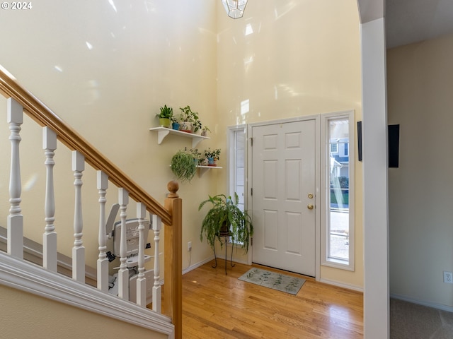 15337 SE Olds Dr, Clackamas, OR 97015 - entryway featuring wood finished floors, stairs, baseboards, and a high ceiling