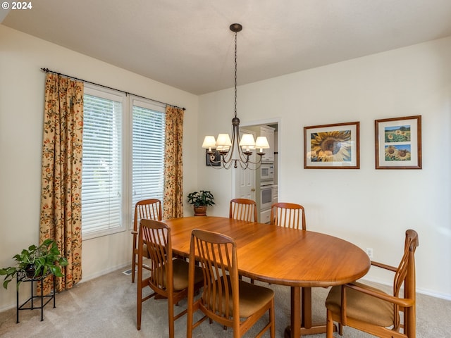 15337 SE Olds Dr, Clackamas, OR 97015 - dining space featuring light carpet, a chandelier, and baseboards