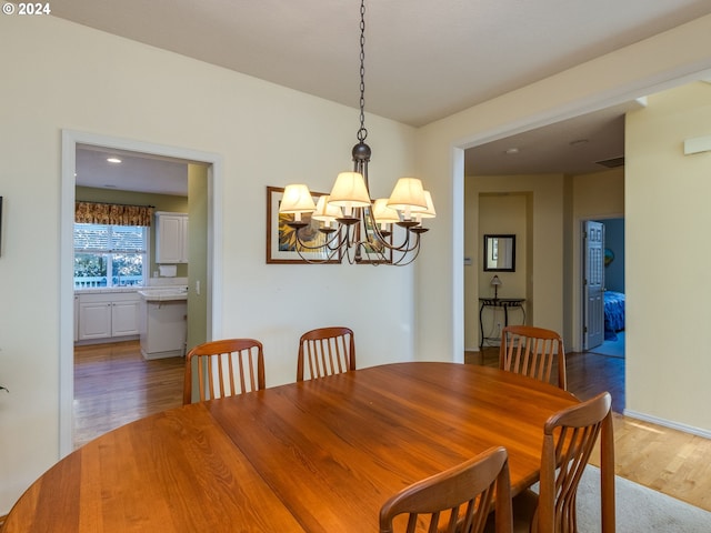 15337 SE Olds Dr, Clackamas, OR 97015 - dining area featuring light wood finished floors and a chandelier