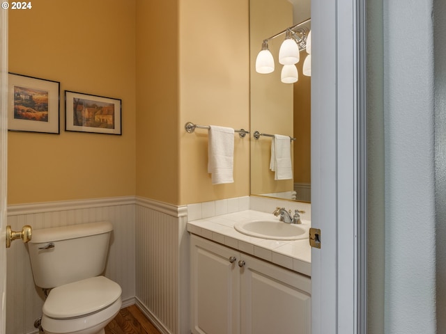15337 SE Olds Dr, Clackamas, OR 97015 - bathroom featuring wainscoting, toilet, and vanity