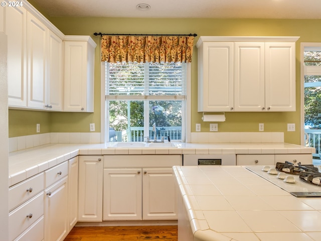 15337 SE Olds Dr, Clackamas, OR 97015 - kitchen with a sink, tile countertops, white cabinets, white gas cooktop, and recessed lighting