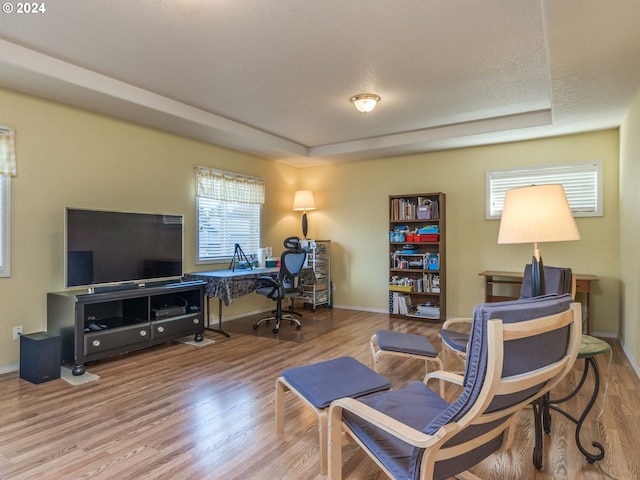 15337 SE Olds Dr, Clackamas, OR 97015 - office area featuring wood finished floors, plenty of natural light, a raised ceiling, and baseboards