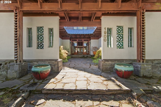 entrance to property with french doors and a patio