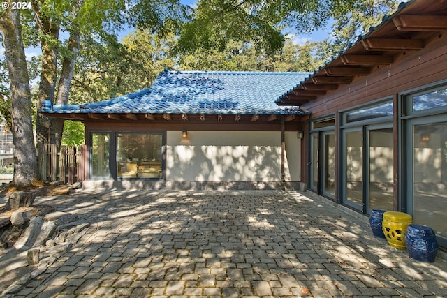 view of patio featuring fence