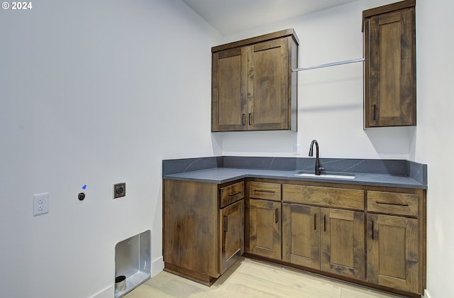 kitchen with light hardwood / wood-style floors and sink