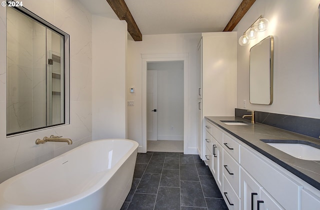 bathroom with beamed ceiling, tile patterned flooring, a bath, and vanity