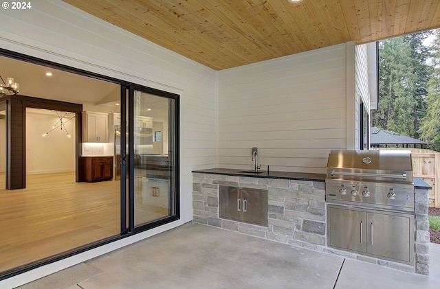 view of patio featuring sink and grilling area