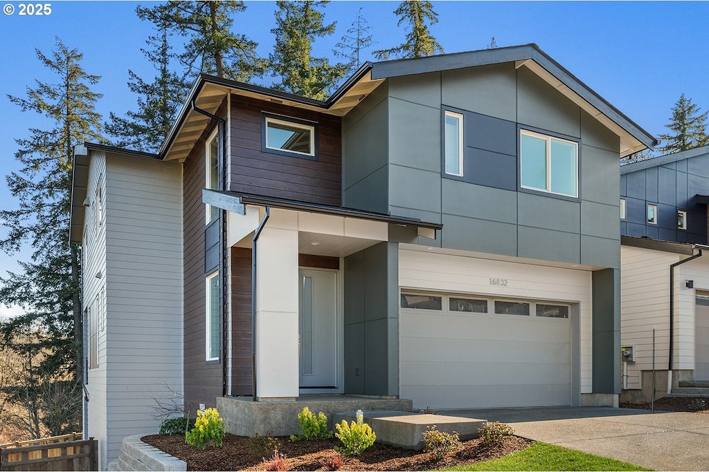 modern home with an attached garage and driveway