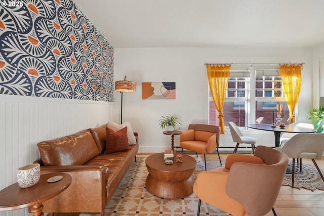 living room featuring light hardwood / wood-style floors and a baseboard heating unit