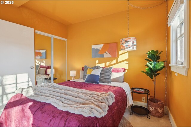 bedroom featuring a closet and carpet floors