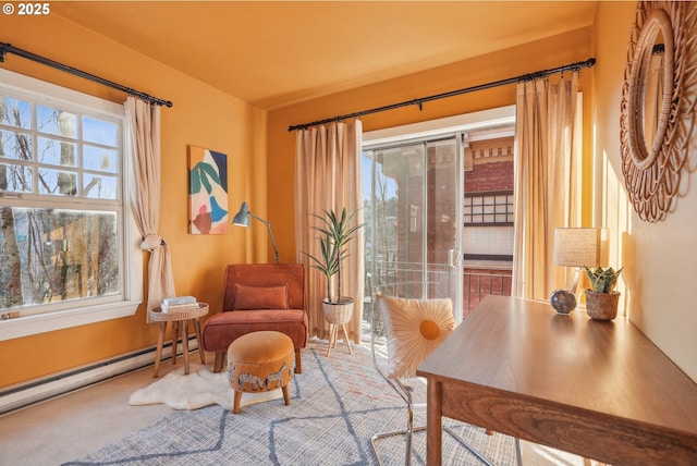 sitting room with carpet floors and baseboard heating