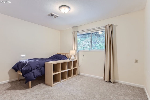 bedroom with light carpet