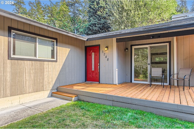 property entrance with a wooden deck