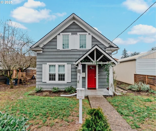 bungalow with a front yard