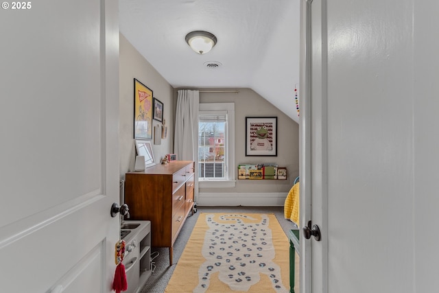 entryway featuring lofted ceiling