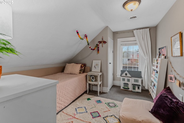 carpeted bedroom featuring lofted ceiling