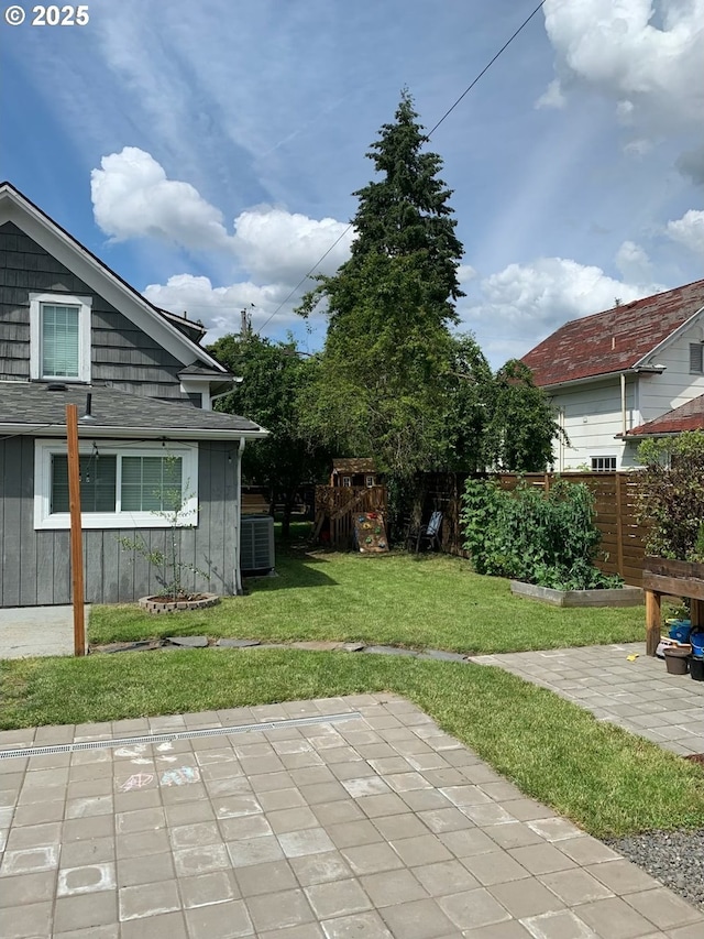 view of yard with a playground and a patio area