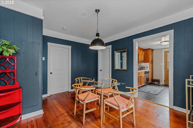 dining space with hardwood / wood-style floors