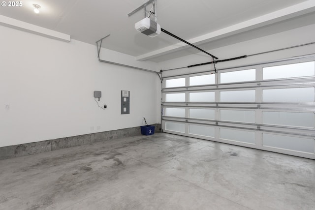 garage featuring electric panel and a garage door opener