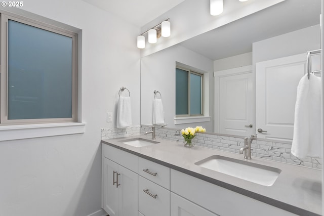 bathroom featuring decorative backsplash and vanity