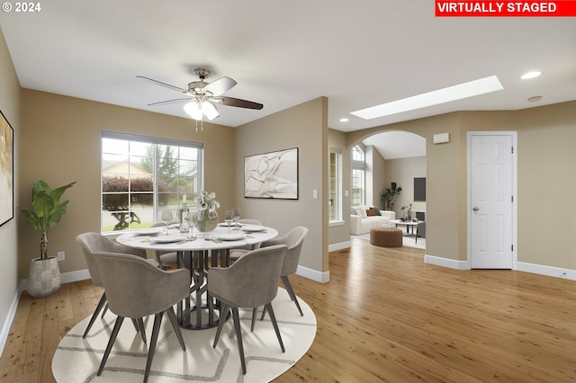 dining space featuring ceiling fan and light hardwood / wood-style floors