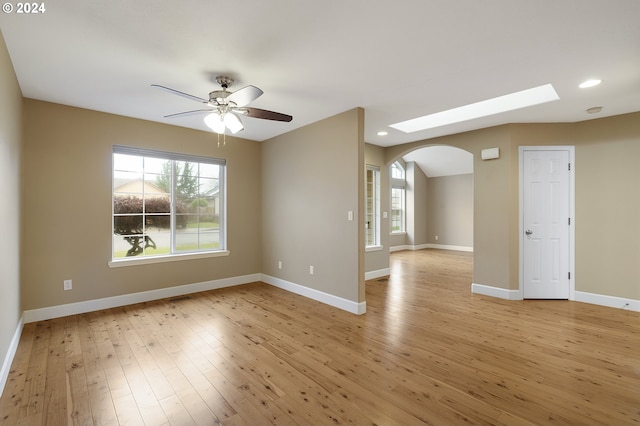 empty room featuring light hardwood / wood-style flooring and ceiling fan