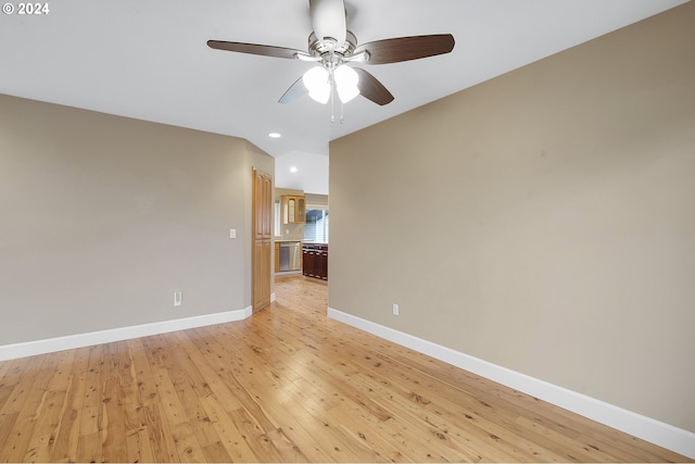 empty room featuring ceiling fan and light hardwood / wood-style flooring