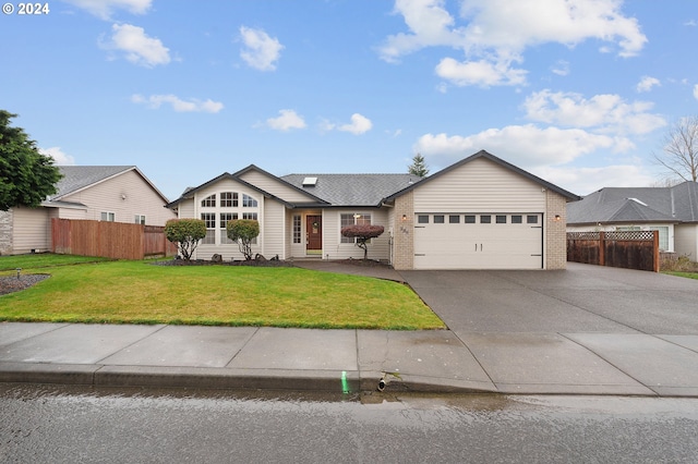 ranch-style home featuring a front yard and a garage