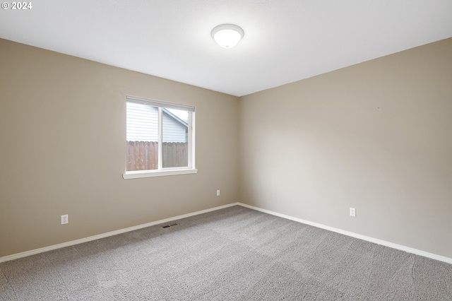 spare room featuring carpet flooring