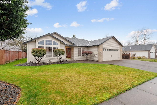 ranch-style home with a garage and a front yard