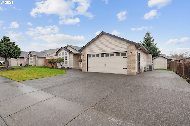 single story home featuring a garage, a front lawn, and cooling unit