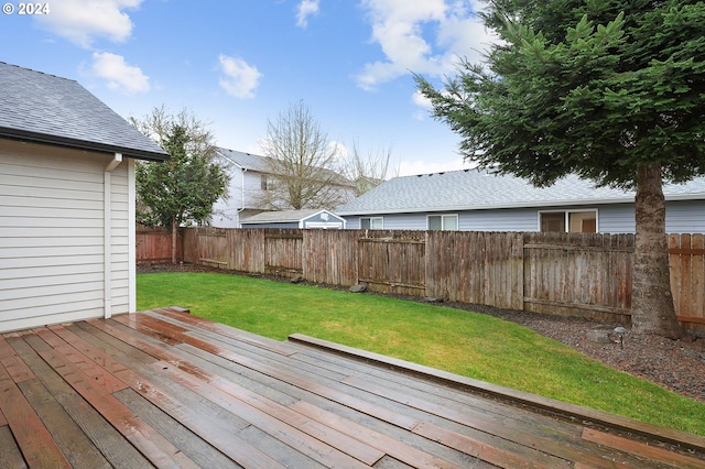 wooden deck with a yard