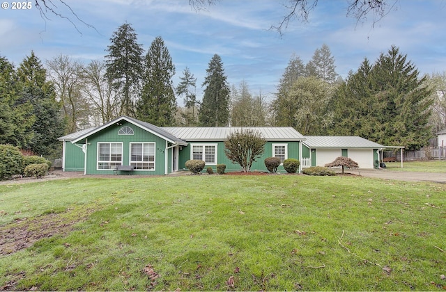 ranch-style house featuring a front lawn and a carport