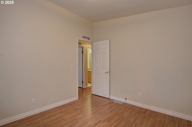 unfurnished room featuring light hardwood / wood-style flooring