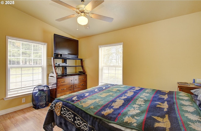 bedroom with lofted ceiling, light wood-type flooring, and ceiling fan