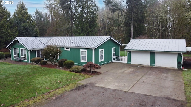 ranch-style house with a garage and a front yard