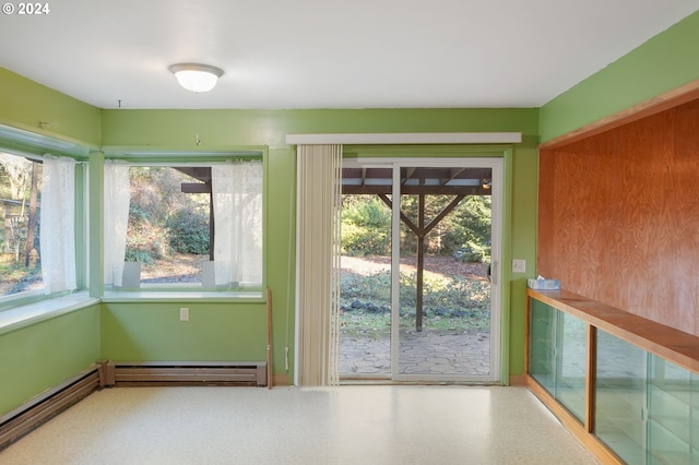 entryway with baseboard heating and a healthy amount of sunlight