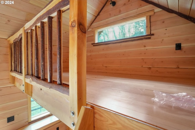 interior space featuring wood walls, lofted ceiling, and wood ceiling