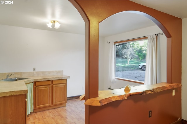 kitchen featuring light hardwood / wood-style floors and sink