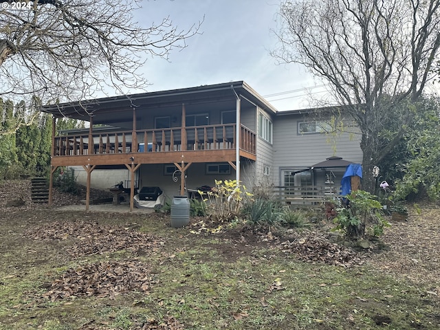 back of house with a patio