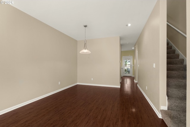 spare room with dark hardwood / wood-style floors