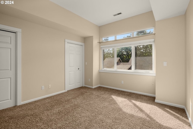 unfurnished bedroom featuring carpet