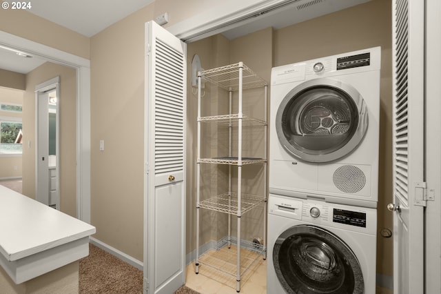 washroom with stacked washer and clothes dryer