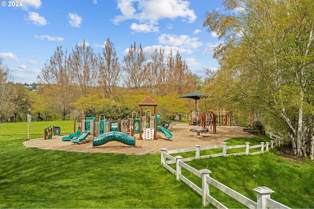 view of playground with a lawn