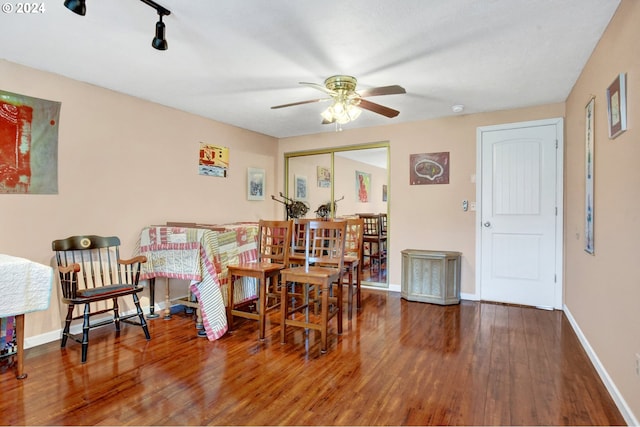 dining room with hardwood / wood-style flooring and ceiling fan