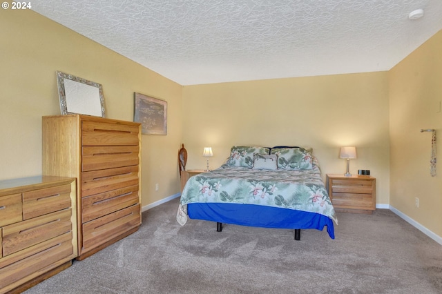 carpeted bedroom featuring a textured ceiling