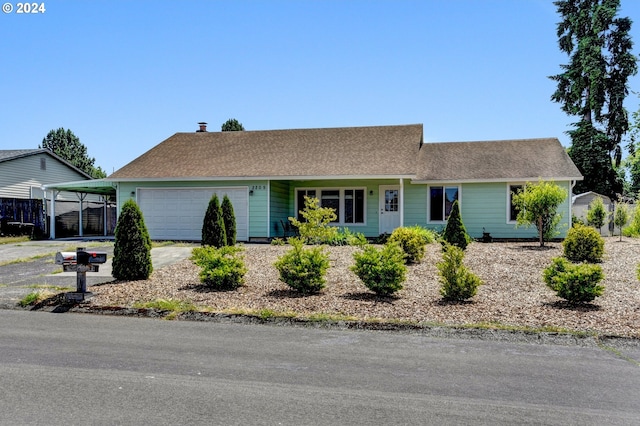 ranch-style home with a carport and a garage